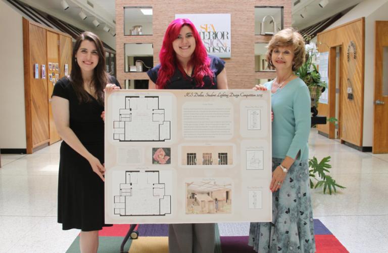 SFA junior interior design majors Jessalyn Welch and Hayley Breshears pictured, with Dr. Mitzi Perritt, holding their feminine boutique design