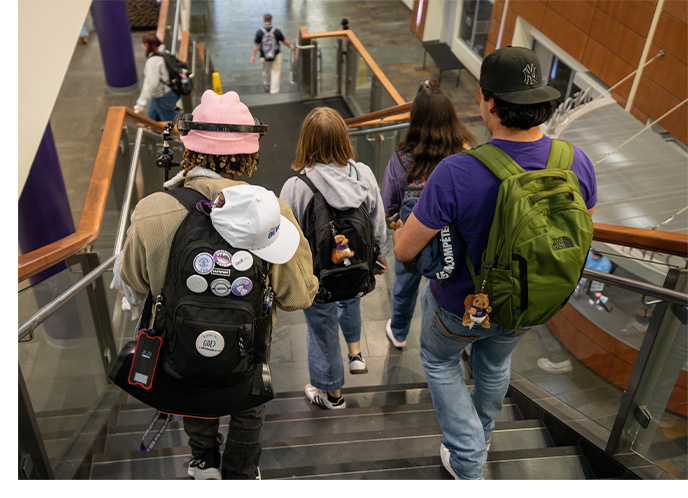 Students walking down stairs