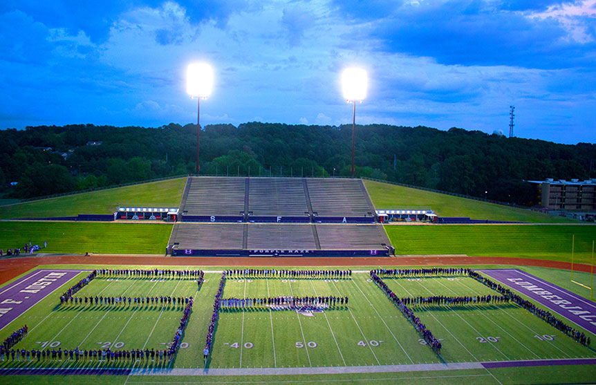 Students spelling "SFA" at Home Bryce Stadium