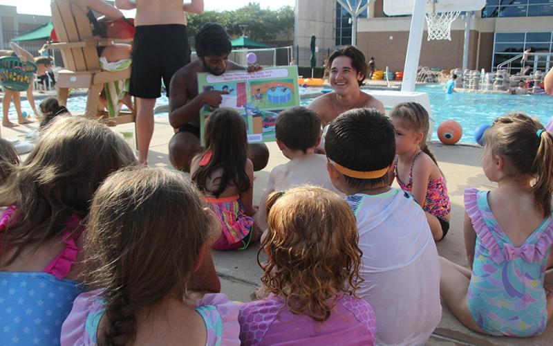 Children listening to a swim instructor