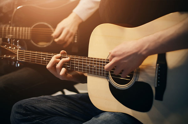 stock image of people playing guitar