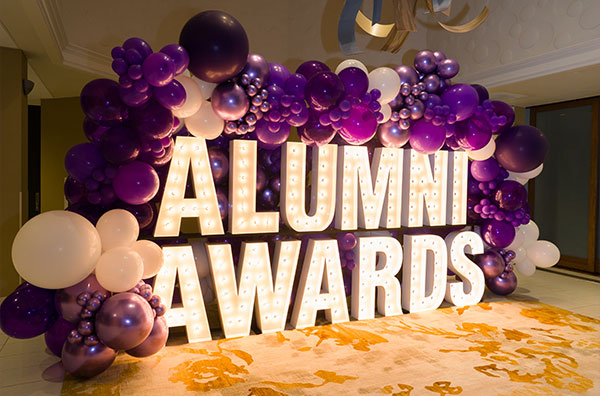 Event signage saying Alumni Awards