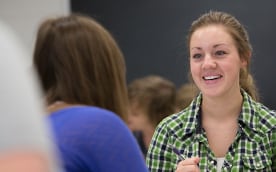 A female student converses with a classmate