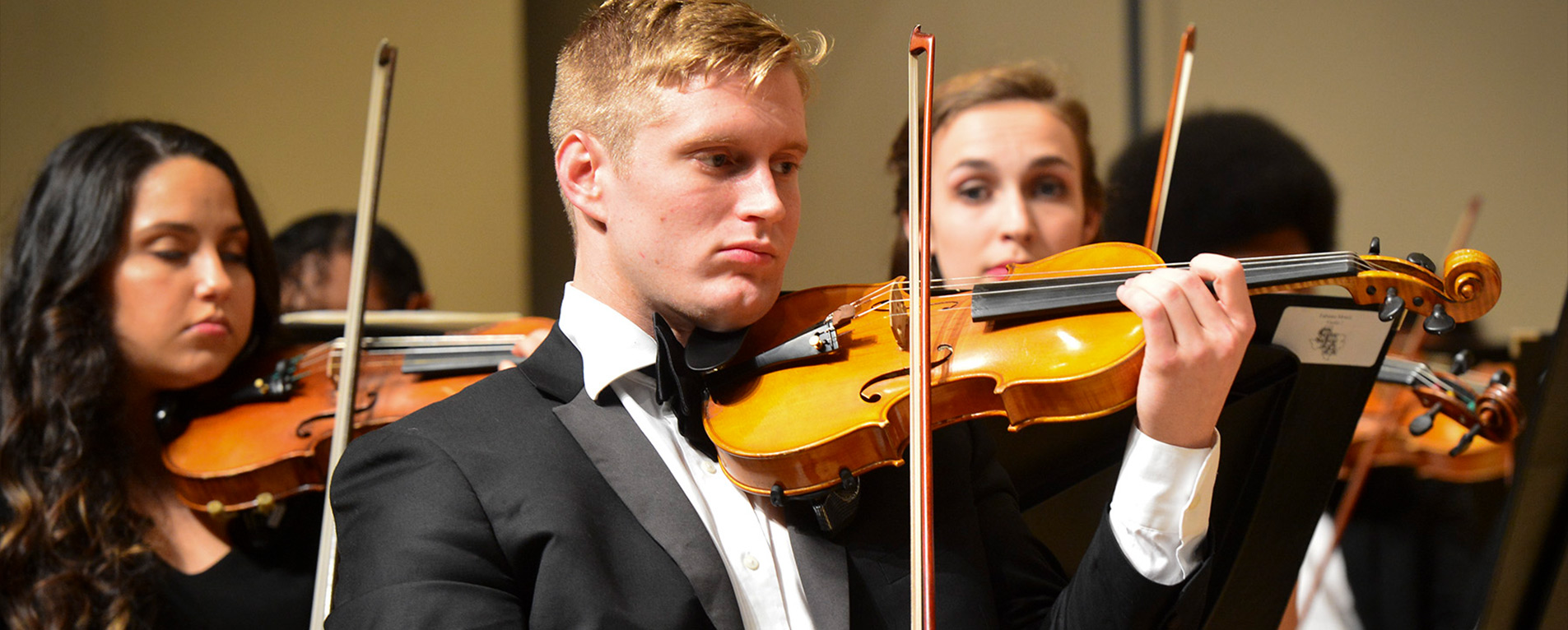 Students playing violins