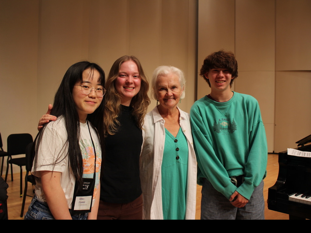 Piano students pose for the camera with a program faculty member