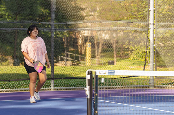 Student playing pickleball