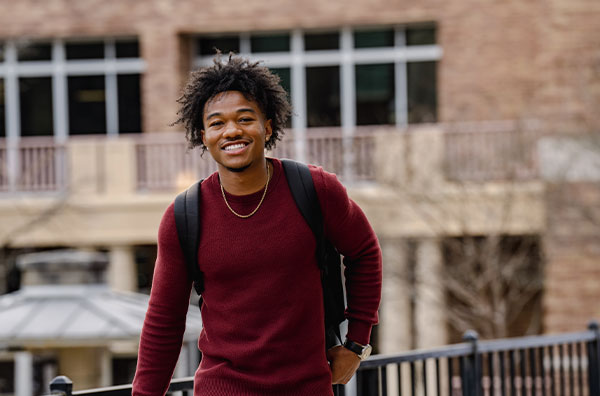 Student smiling at camera