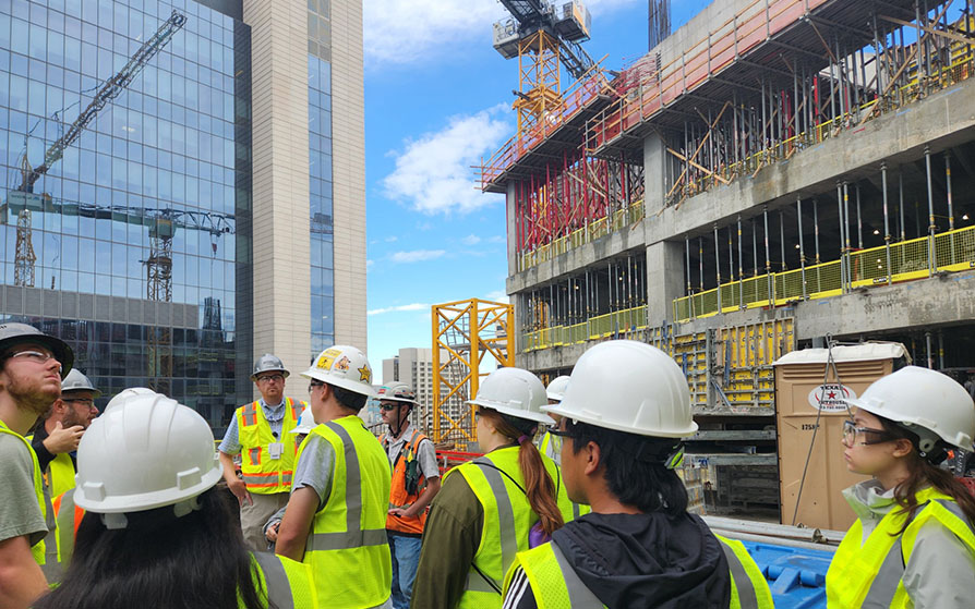 Construction Management students touring skyscraper construction site