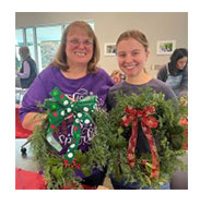 mother and daughter with wreaths