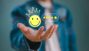 man holding a smiling emoji with a 5-star rating