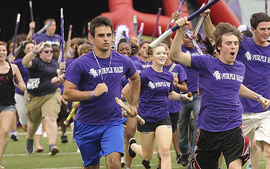 SFA students charging on to the field