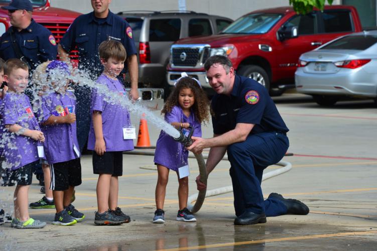 Little STEM Jacks students and emergency personnel interacting