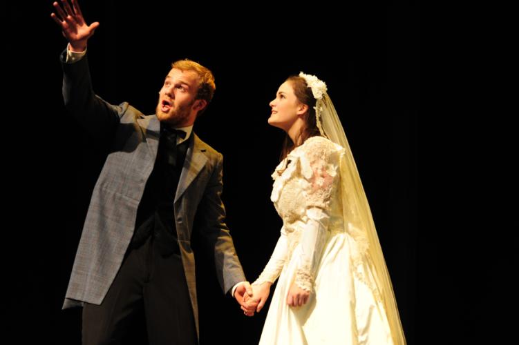 Junior Thomas Falconar, Rose Bruford American Theatre Arts student from London, England, as Curly, and senior Sidney Lowell of Huffman as Laurey.