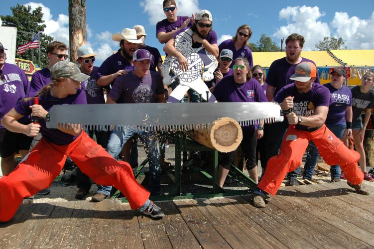 Katie Adams and Brody Capps, both SFA forestry majors, compete in the Jack and Jill crosscut competition.
