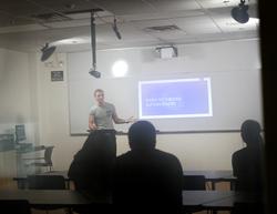 Stephen F. Austin State University graduate student Samuel Johnson demonstrates how to use the One Button Studio in the McGee Business Building, Room 322. 