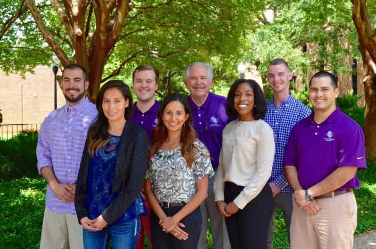 Marleta Chadwick Financial Advisors Corey Belcher and Brian Cook; Dr. Banker Phares, SFA economics and finance professor and director of the financial banking program; advisor Clark Taylor; advisor Flo Soto; SFA graduate and founding member Jenny Rosales; advisor Mi-Kayla Lemon; and SFA graduate and founding member Antonio Badillo.