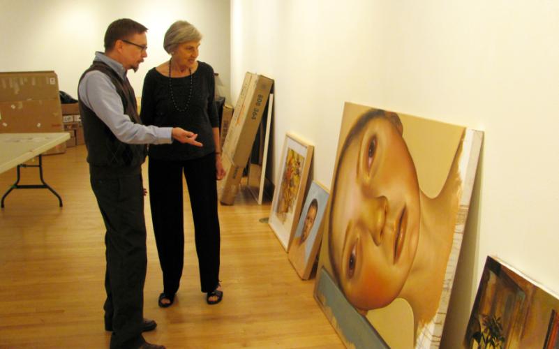 John Handley, SFA galleries director, confers with Eloise Adams, former galleries director, regarding the entries to be included in 2014 Texas National.