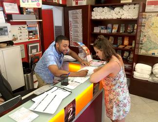 SFA senior hospitality administration major Phillip Richardson of Beaumont points out the best local attractions to an international traveler.