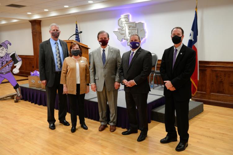 photo of Dr. Jim Nelson, director of the RELLIS Academic Alliance and associate vice chancellor of the Texas A&M University System; Dr. Nancy Jordan, provost of the RELLIS Academic Alliance and associate vice chancellor of the Texas A&M University System; John Sharp, chancellor of the Texas A&M University System; Dr. Scott Gordon, SFA president; and Dr. Steve Bullard, provost and vice president of Academic Affairs at SFA