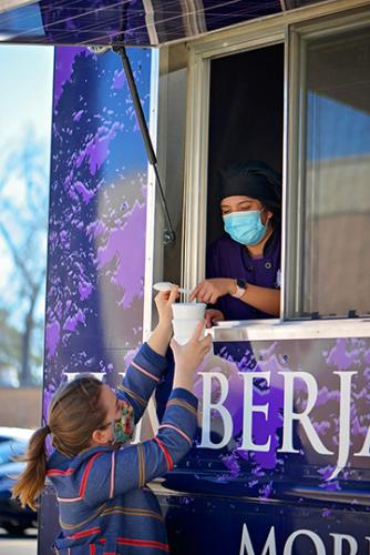 student purchasing homemade ice cream from SFA's Lumberjack Express student-run food truck