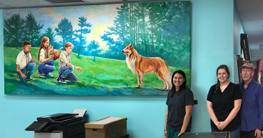 mural of Lassie with three children, one holding a cat 