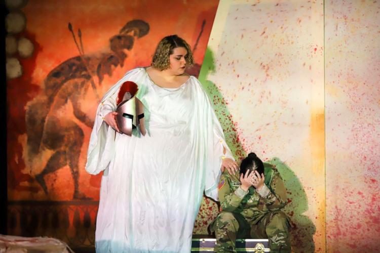 a scene from "Ajax in Iraq" with Sara Clark, SFA theatre student from Allen, as Athena, and Abigail McCalister, Panola theatre student from Rusk, as Mangus