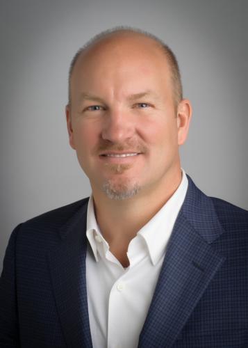 Mike Karns will give the May commencement addresses