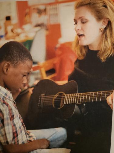 Dr. Shannon Darst is pictured singing to a student 