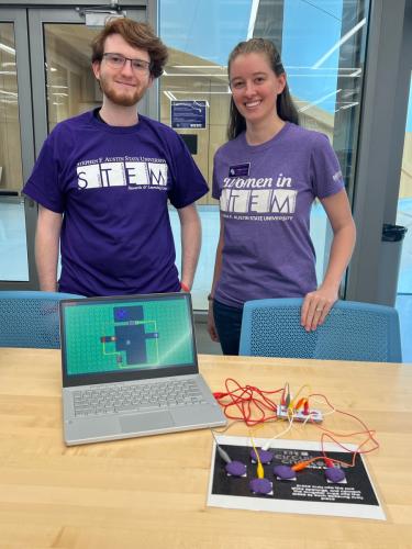 Mikey Hill, junior computer science major, and Corina Rivera, SFA’s STEM Research and Learning Center outreach coordinato
