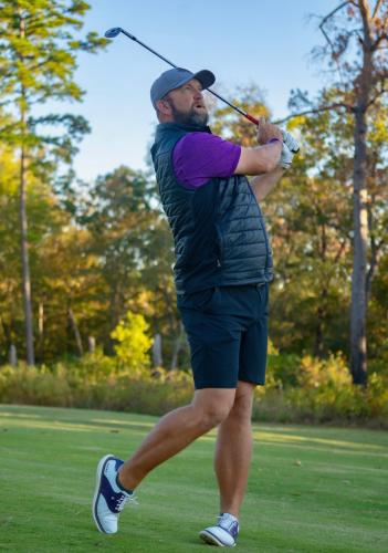 photo of Jonathan Shuskey swinging a golf club