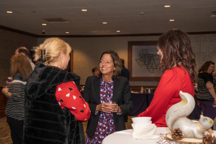 Dr. Lee Furbeck chats with faculty and staff during a welcome reception