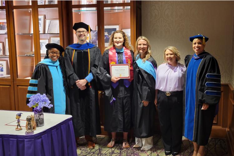 Paige Vadnais appears with Dr. Veronica Beavers, Dr. Pietro A. Sasso, Dr. Hollie Smith, Lacey Folsom and Dr. Michara DeLaney-Fields