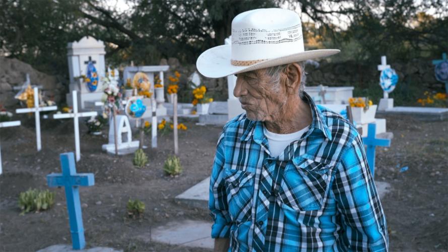 A scene from the film depicting a grandfather in a cemetery