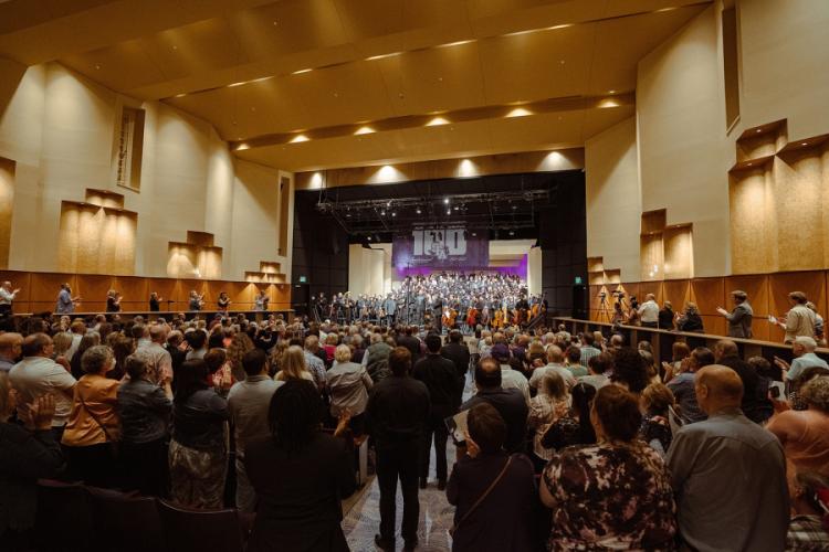 a standing ovation at the end of the world premiere of "How Proud the Pines" during Stephen F. Austin State University's Centennial Concert