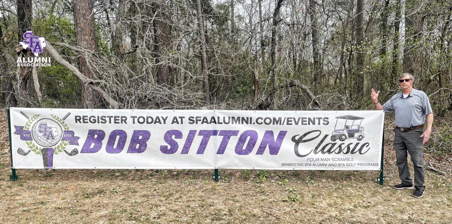 Bob Sitton stands alongside the Bob Sitton Classic sign