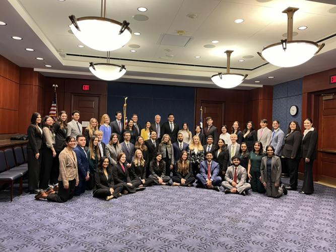 Stephen F. Austin State University’s Tara Bocock photographed with United States Sen. John Cornyn and the Archer Fellowship Program cohort