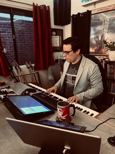 Lance Treviño composing in a digital studio