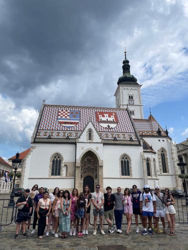 SFA students and faculty pose for the camera in front of St. Mark's Church in Zagreb