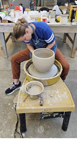 Lauren Selden throws a planter in SFA’s ceramics studio