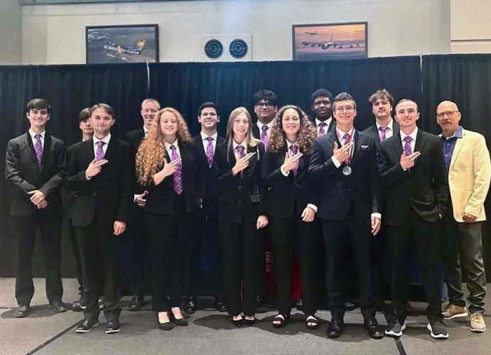 group photo of the thirteen SFA students in the aviation science program who competed against the region's top flight programs at the National Intercollegiate Flying Association’s SAFECON 2024 in Waco