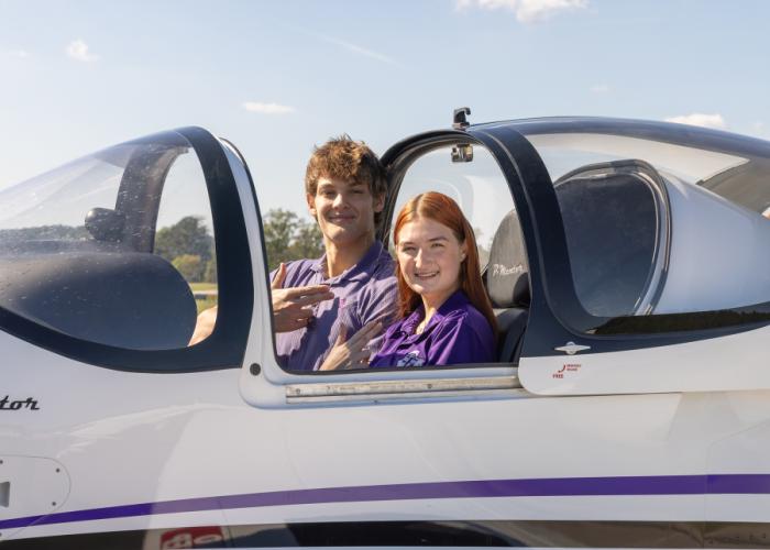 Johnna Edwards and Sayer Swinford in the cockpit of one of SFA's airplanes
