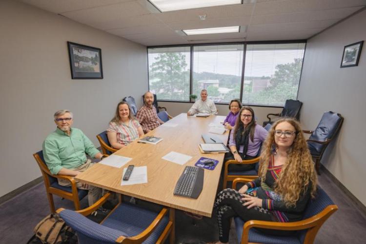 Members of the 2024 Research Advisory Council gather at a conference table