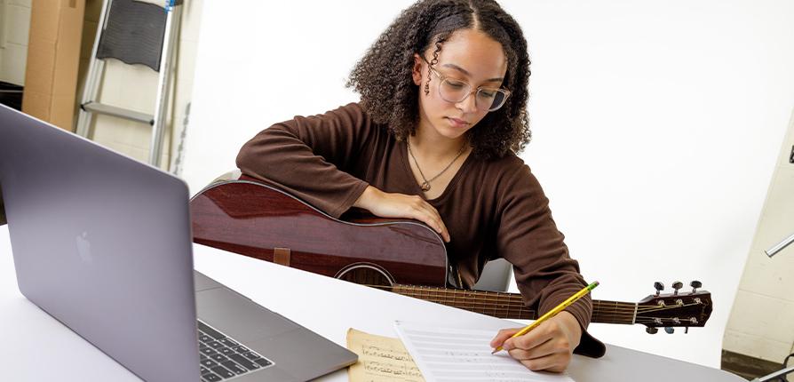 SFA student composing music