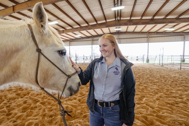 Jenny Baker with a horse from SFA's Equine Center