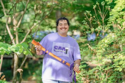 student holding axe handle