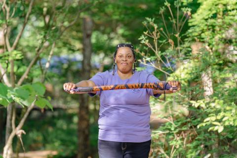 student holding axe handle