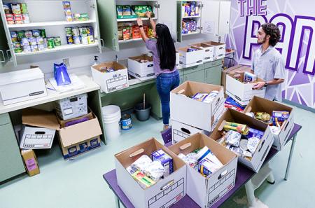 Accounting graduate student and president of the Traditions Council Cole Muske from Friendswood serves as a student assistant for student affairs and student engagement. He helped package and distribute boxes of food for students during spring and summer. Aimee Pecina ’20, a psychology graduate from Longview, volunteered at The Pantry and Nacogdoches HOPE food pantry. Photo by Hardy Meredith ’81
