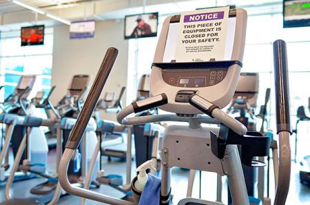 Safety precautions are in place at the Student Recreation Center. To comply with physical distancing guidelines, access to equipment is staggered, and sanitizer is readily available throughout the center to help keep everyone safe. Photo by Robin Johnson ’99 & ’19