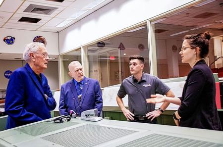 Volkman directs Apollo 11 and Apollo 13 Flight Director Gene Kranz, second from left, and Apollo astronaut Charlie Duke, left, for NASA's broadcast “NASA's Giant Leaps: Past and Future” inside the historic Apollo Mission Control Room. Photo courtesy of NASA