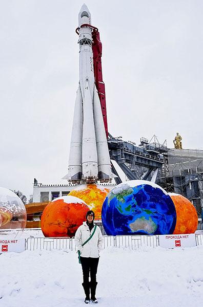 During a work trip in February 2018 to Moscow, Russia, Volkman poses in front of a rocket display. Photo courtesy of Sarah Volkman